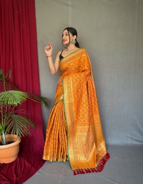 yellow patola silk saree with patola fusion all over contrast patola weaved with contrast meenakari and rich pallu with tassels attached fabric weaving work festive 