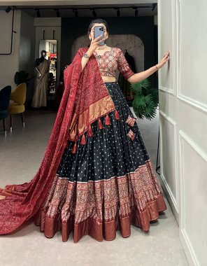 black lehenga - dola silk | lehenga work - bandhani and ajarakh print with foil work | waist - supported upto 42 | closer - drastring with heavy tassels and zip | stitching - stitched with canvas and attached with cancan | length - 42 | flair - 3.60 m | inner - micro cotton ( stitched ) | blouse - dola silk with ajrakh printed with foil work | blouse length - 0.80 m | dupatta - dola silk bandhani print and gotta patti lace with tassels ( 2.5 m) fabric printed work festive 