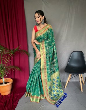 dark green pure patola silk saree with paithani and patola fusion all over contrast patola weaved with contrast meenakari and rich pallu with tassels attached  fabric weaving  work ethnic 
