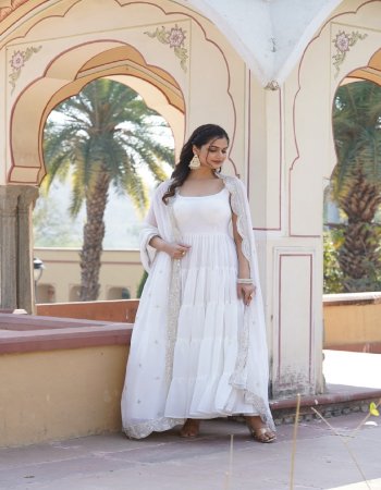 white top - faux georgette | length - 56 inch | flair - 15m approx | linning - cotton ( full inner top to bottom ) | sleeves - sleeveless ( sleeves fabric attached inside ) | stitching type - 5 layer frill stitching | dupatta - faux georgette with rich sequance embroidery work | length - 2.3m approx  fabric embroidery work ethnic 